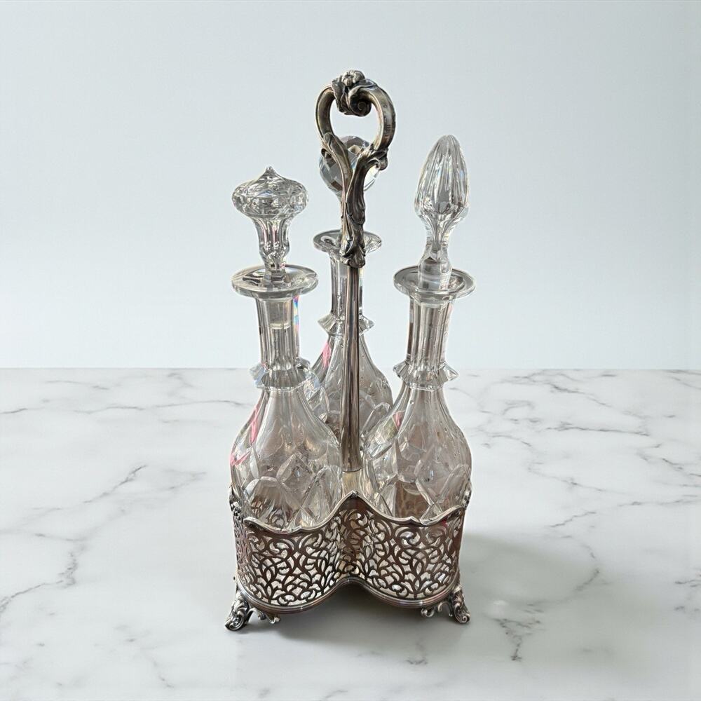Hawksworth Eyre & Co 3-Bottle Tantalus Crystal Decanters & Silver Plate Stand